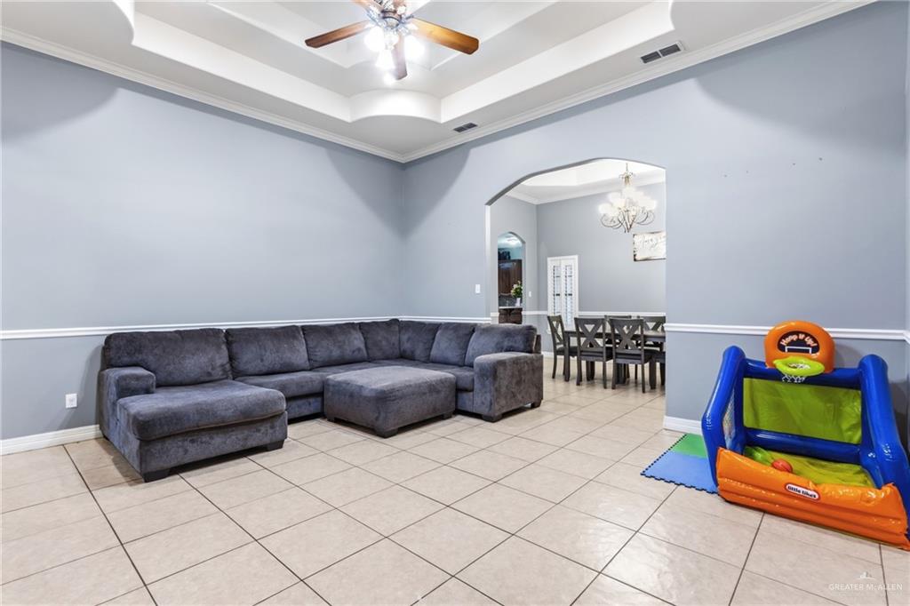 22602 Rio Rancho Road Harlingen, TX 78552 - Photo 6 of 26 a living room with furniture and kitchen view
