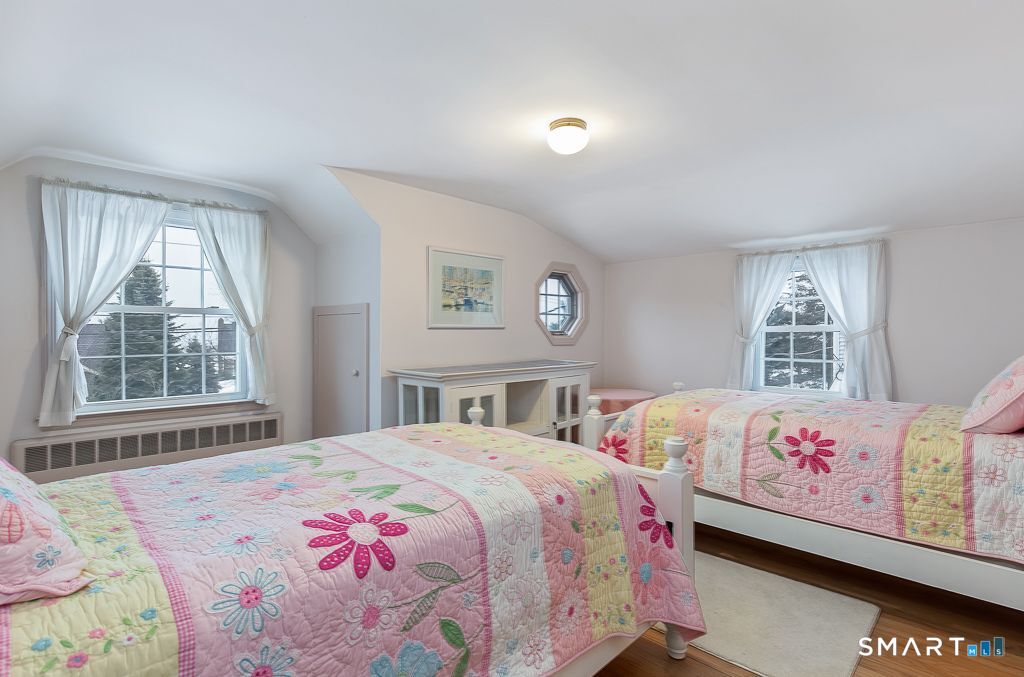 13 Dock Road Milford, CT 06460 - Photo 12 of 18 a bedroom with a bed and a window