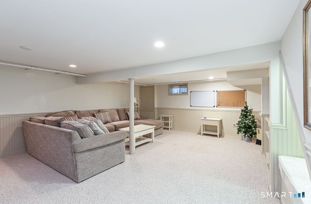 13 Dock Road Milford, CT 06460 - Photo 13 of 18 a living room with furniture and a potted plant