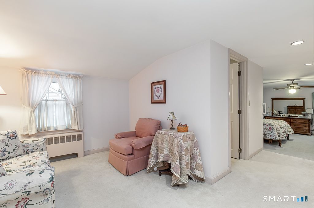 13 Dock Road Milford, CT 06460 - Photo 17 of 18 a bedroom with furniture and a window