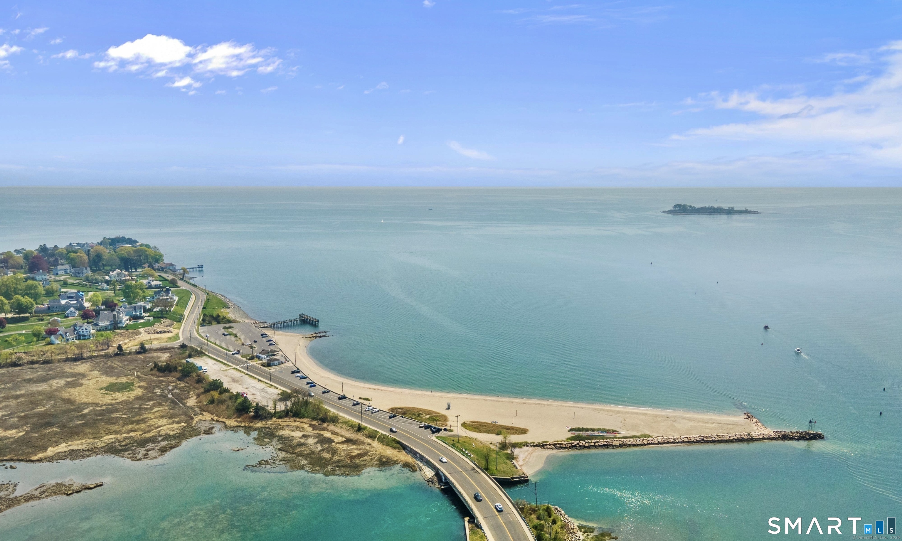 13 Dock Road Milford, CT 06460 - Photo 3 of 18 a view of a lake with a big yard