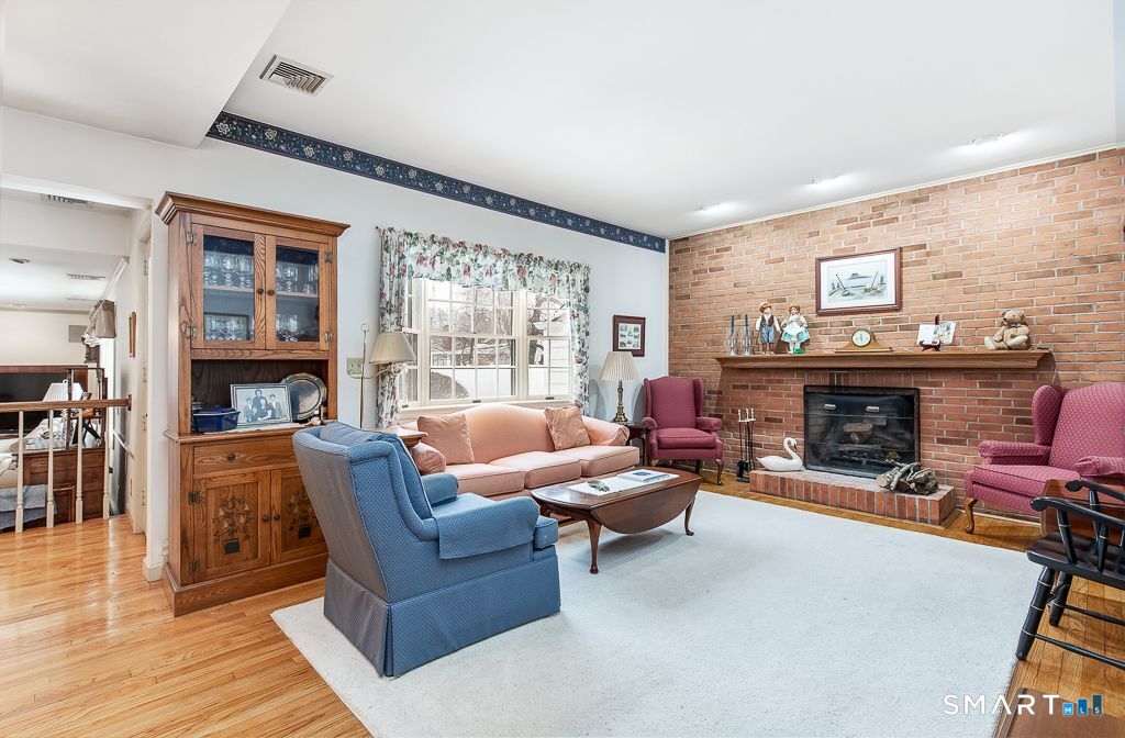 13 Dock Road Milford, CT 06460 - Photo 6 of 18 a living room with furniture and a fireplace