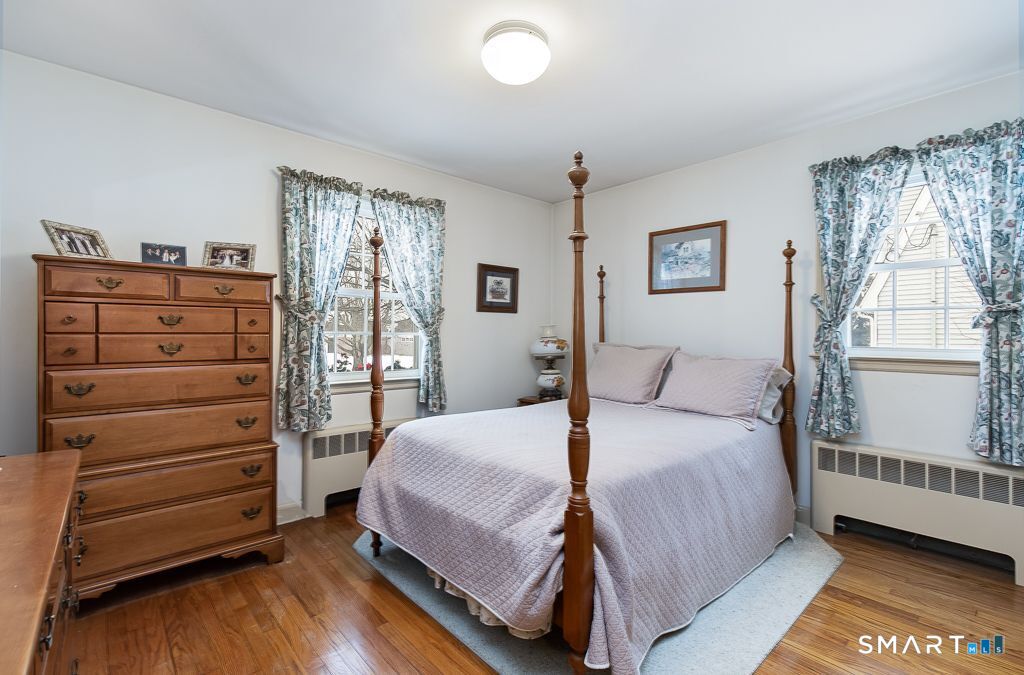 13 Dock Road Milford, CT 06460 - Photo 10 of 18 a bedroom with a bed and a window