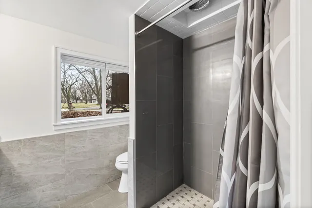a bathroom with a bathtub and shower