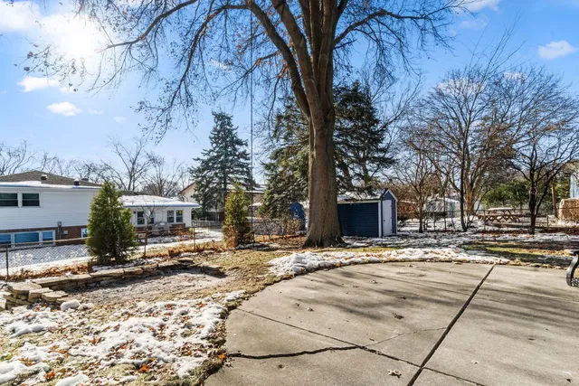 a view of a yard covered in snow