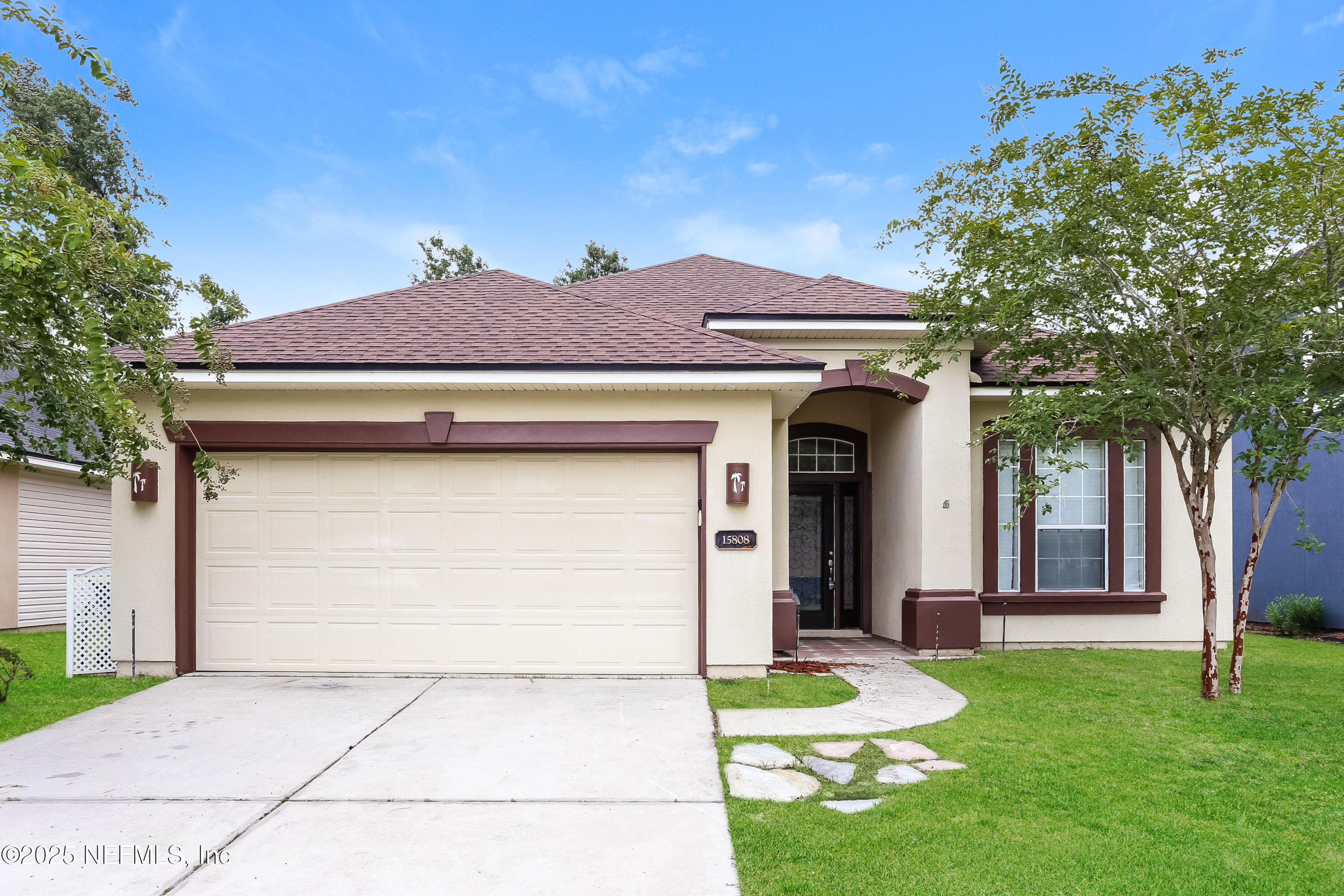 15808 Spotted Saddle Circle Jacksonville, FL 32218 - Photo 1 of 18 a front view of a house with garden
