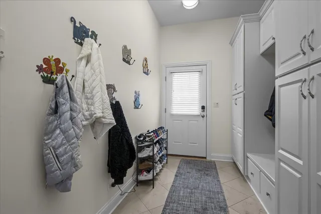 a view of a hallway with paintings on the wall