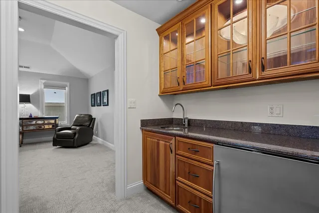 a spacious bathroom with a granite countertop double vanity and a sink