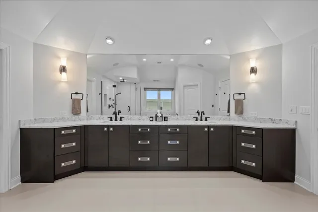 a bathroom with a bathtub and shower