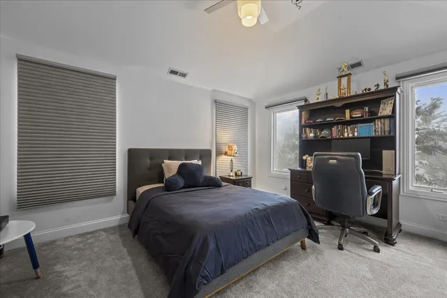 a en suite bathroom with a granite countertop sink and a mirror