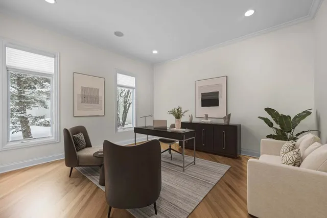 a living room with furniture a window and a flat screen tv