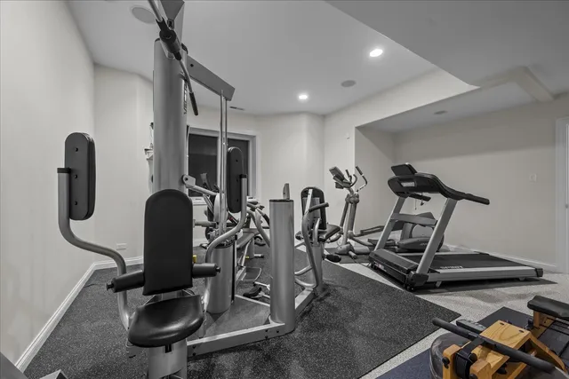 a bedroom with a bed and a chair