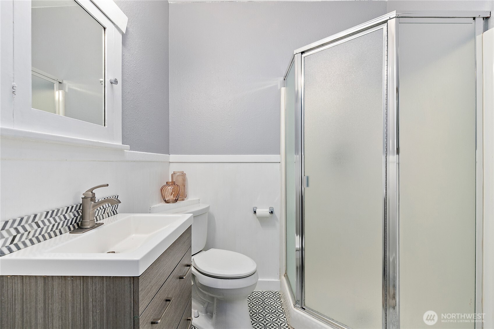 9880 Fredrickson Road Northwest Bremerton, WA 98311 - Photo 13 of 28 a bathroom with a sink a toilet and shower
