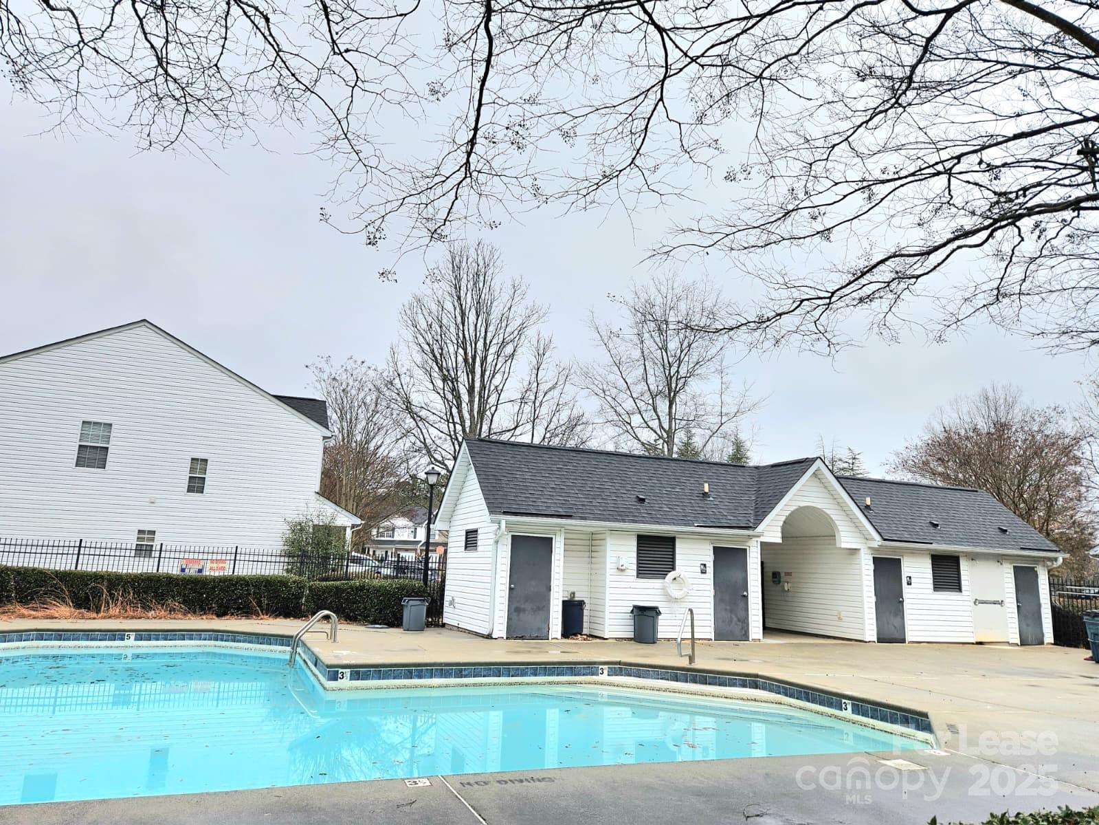 12540 Hennigan Pl Lane Charlotte, NC 28214 - Photo 11 of 11 a view of a white house with a big yard and large tree