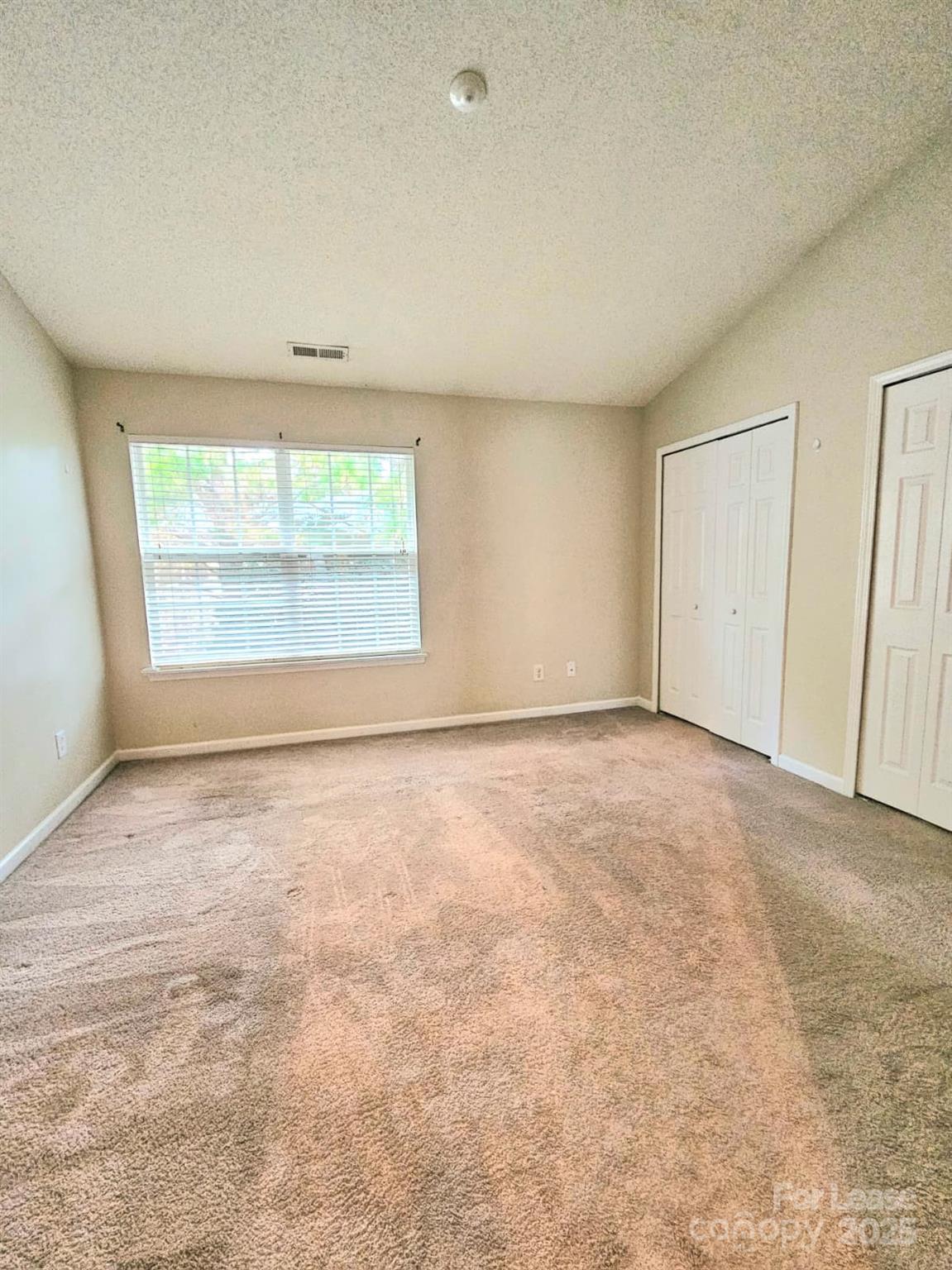 12540 Hennigan Pl Lane Charlotte, NC 28214 - Photo 4 of 11 an empty room with a window