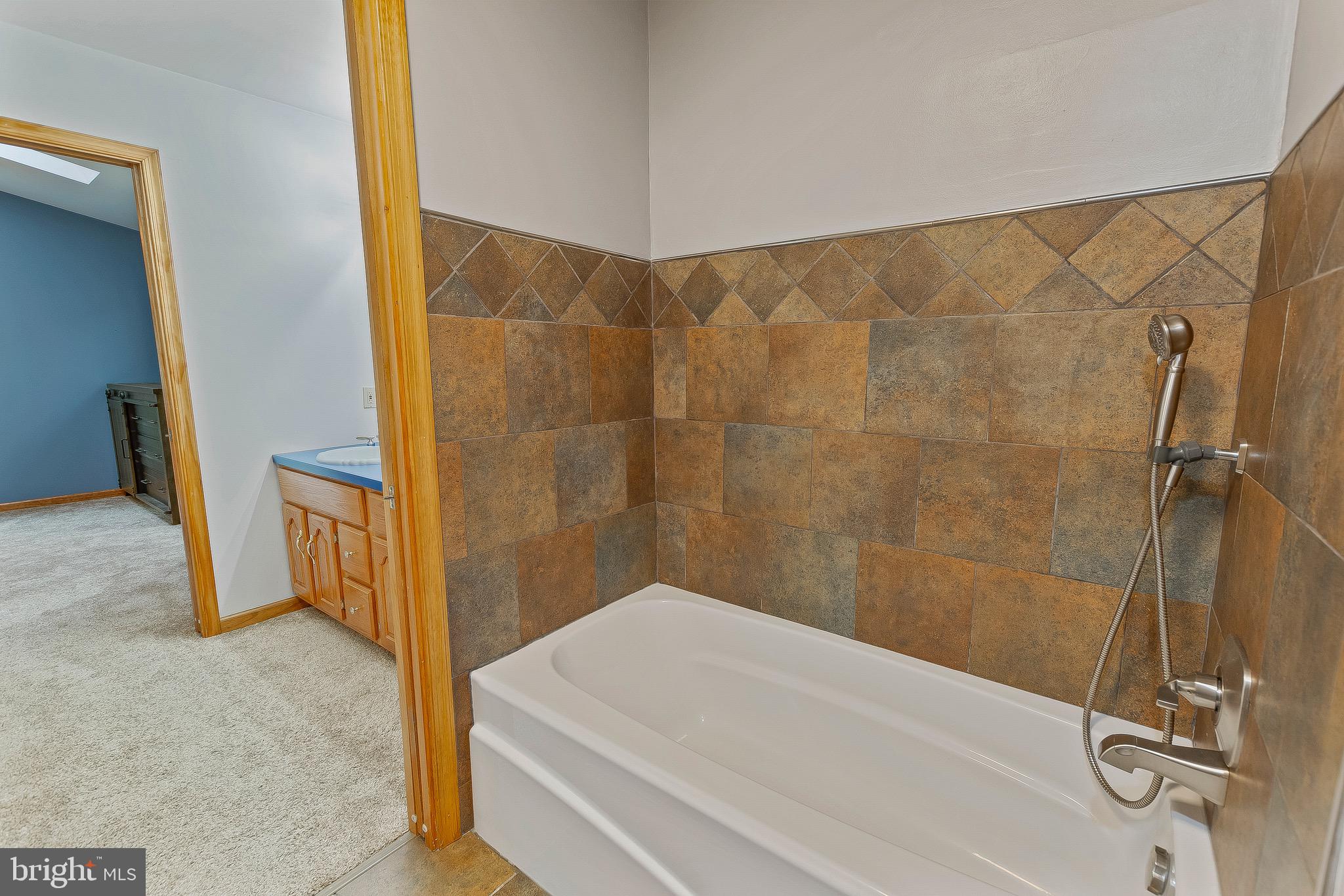 2415 Stoakley Road Prince Frederick, MD 20678 - Photo 23 of 42 a bathroom with a shower