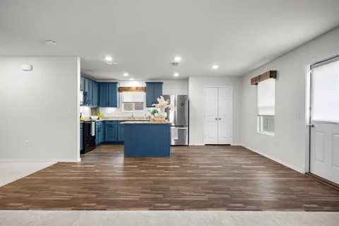 a view of kitchen with wooden floor