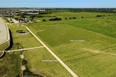 an aerial view of a house with outdoor space