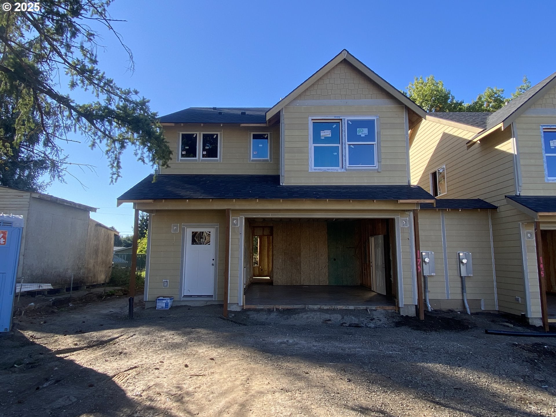 175 West 8th Street Lafayette, OR 97127 - Photo 1 of 6 a front view of a house with a yard and garage