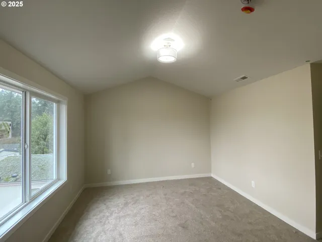 a view of an empty room and window