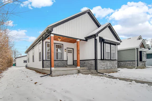 a view of a house with snow on the road