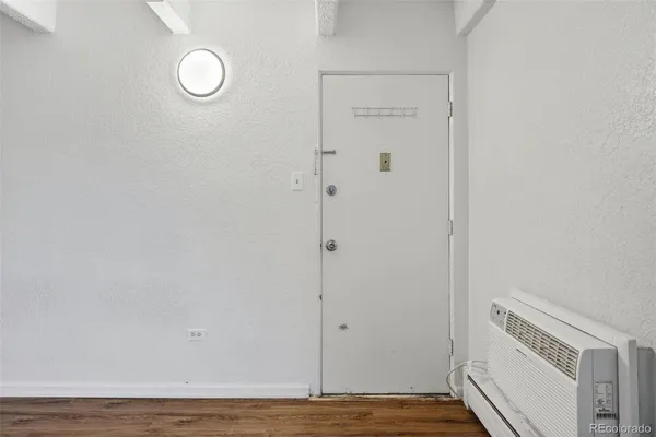 a view of a livingroom with wooden floor