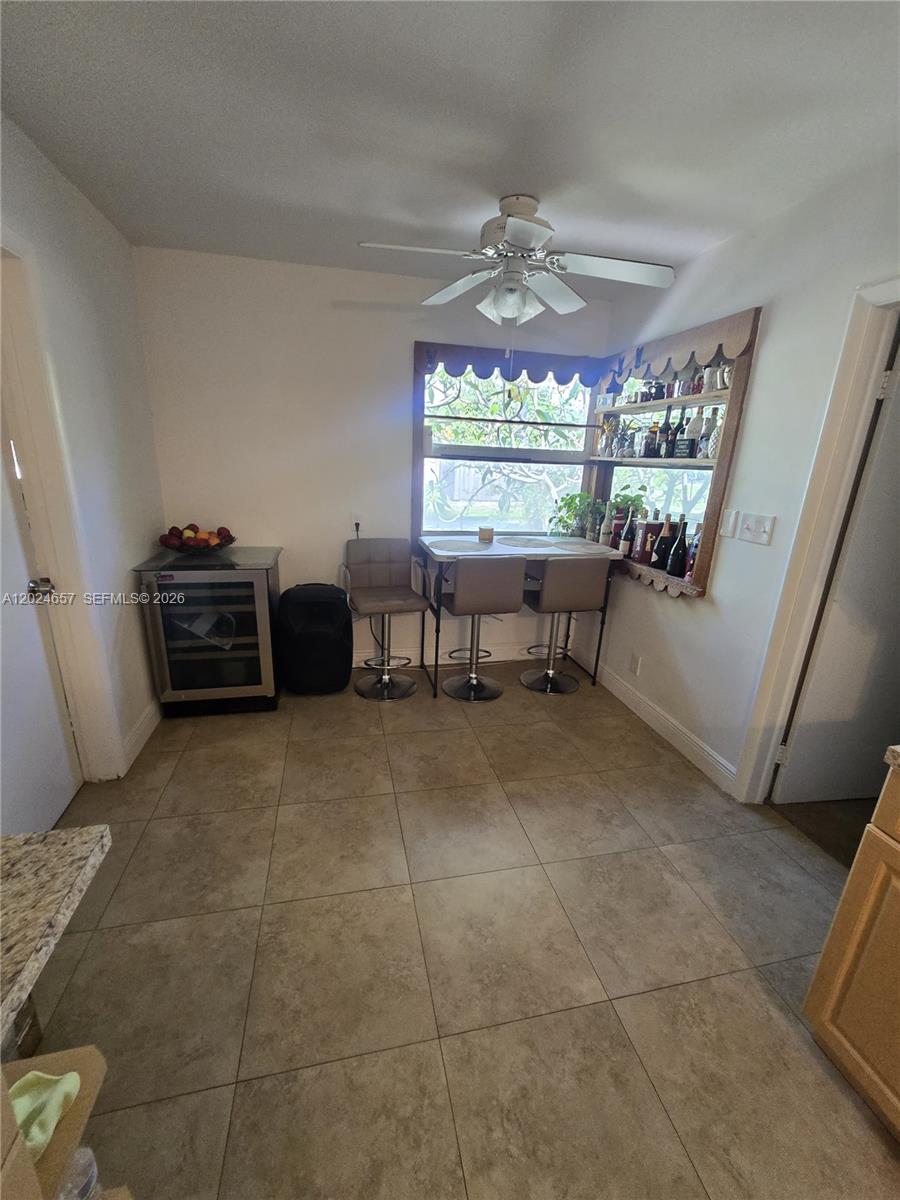 3619 West Park Road Hollywood, FL 33021 - Photo 16 of 19 a living room with furniture and a large window