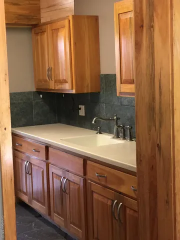a view of a sink and cabinets