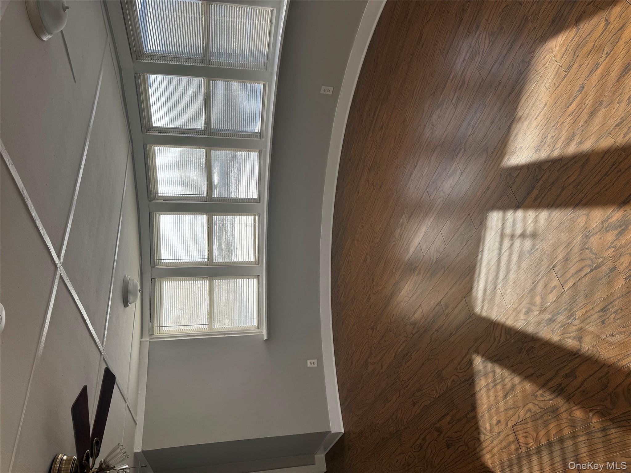 8064 Albany Post Road Red Hook, NY 12571 - Photo 14 of 21 a view of an empty room with wooden floor and a window