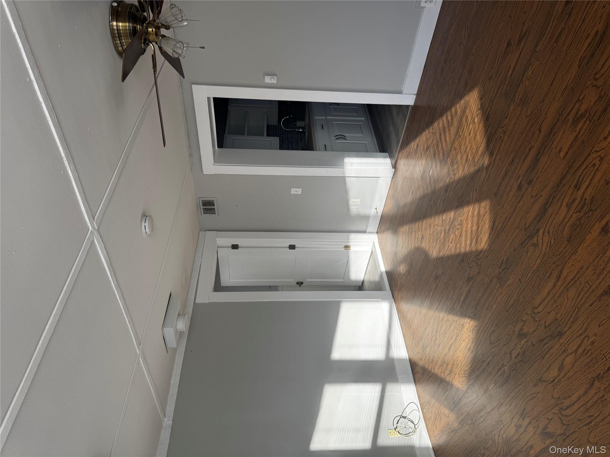8064 Albany Post Road Red Hook, NY 12571 - Photo 16 of 21 wooden floor in an empty room with a window