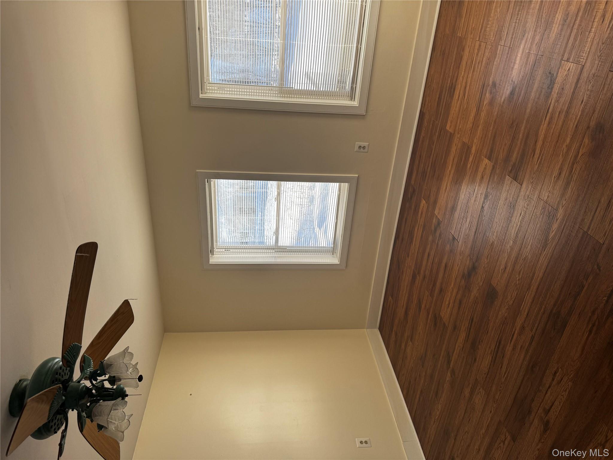 8064 Albany Post Road Red Hook, NY 12571 - Photo 17 of 21 a view of an empty room with a window and wooden floor