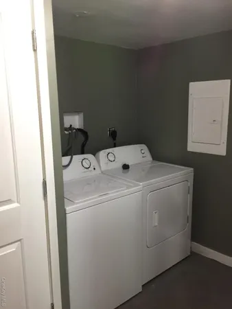 a utility room with dryer and washer