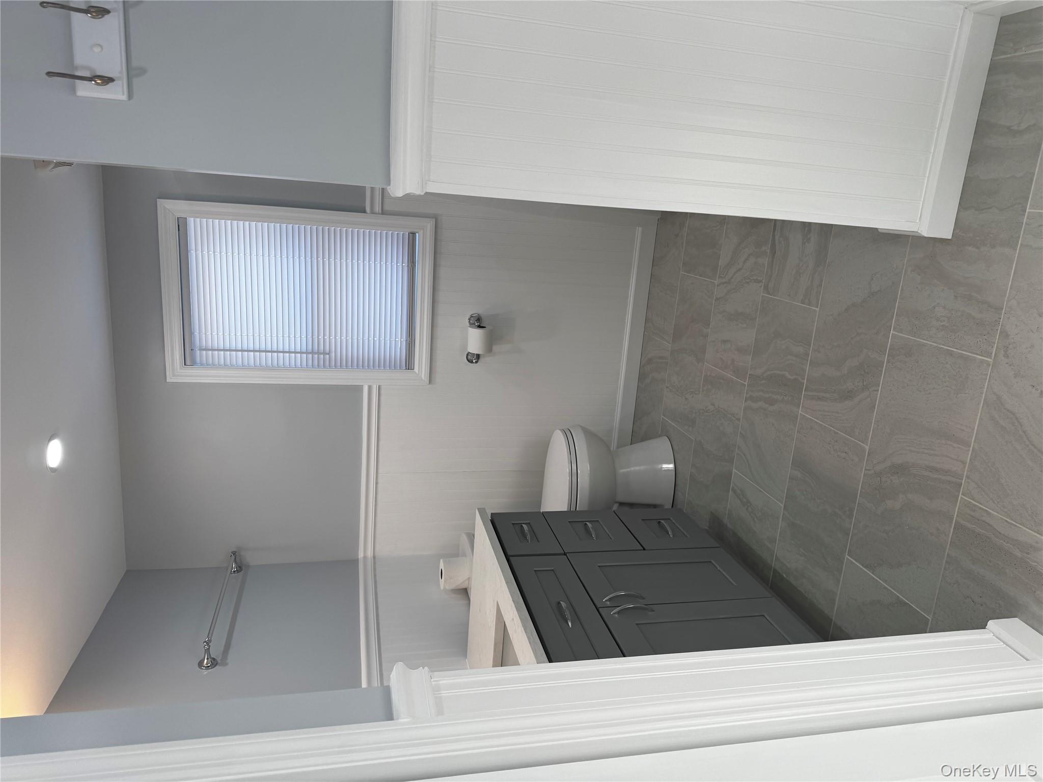 8064 Albany Post Road Red Hook, NY 12571 - Photo 7 of 21 a bathroom with a sink a toilet and shower