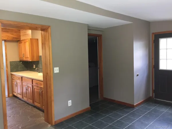 a view of an empty room and window