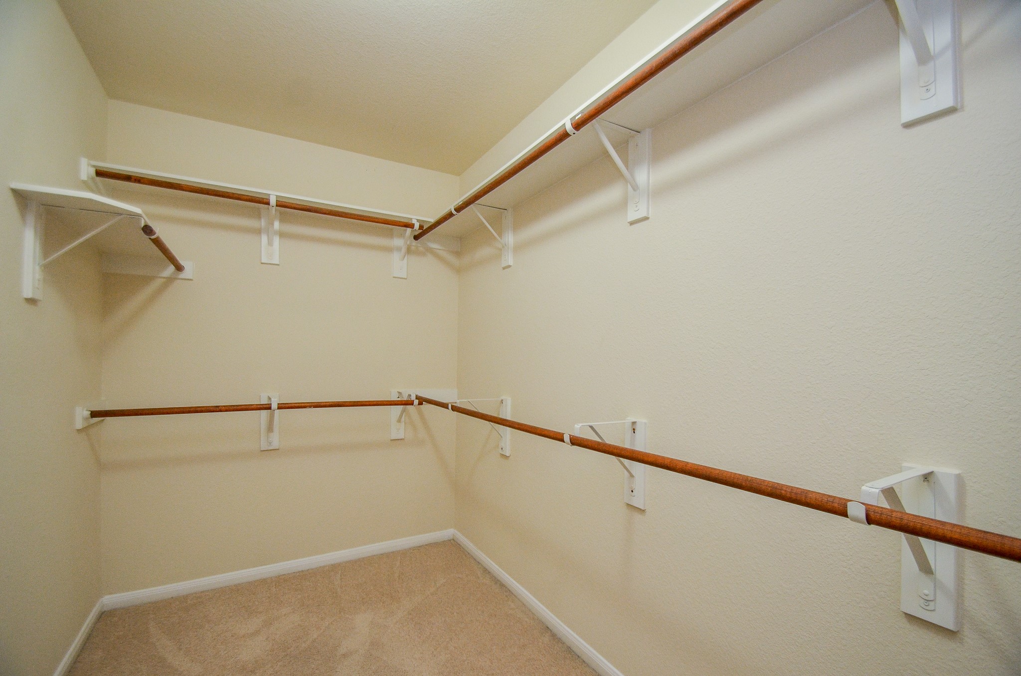 2903 Gaelic Green Street Houston, TX 77045 - Photo 16 of 32 a view of a room with racks on the wall