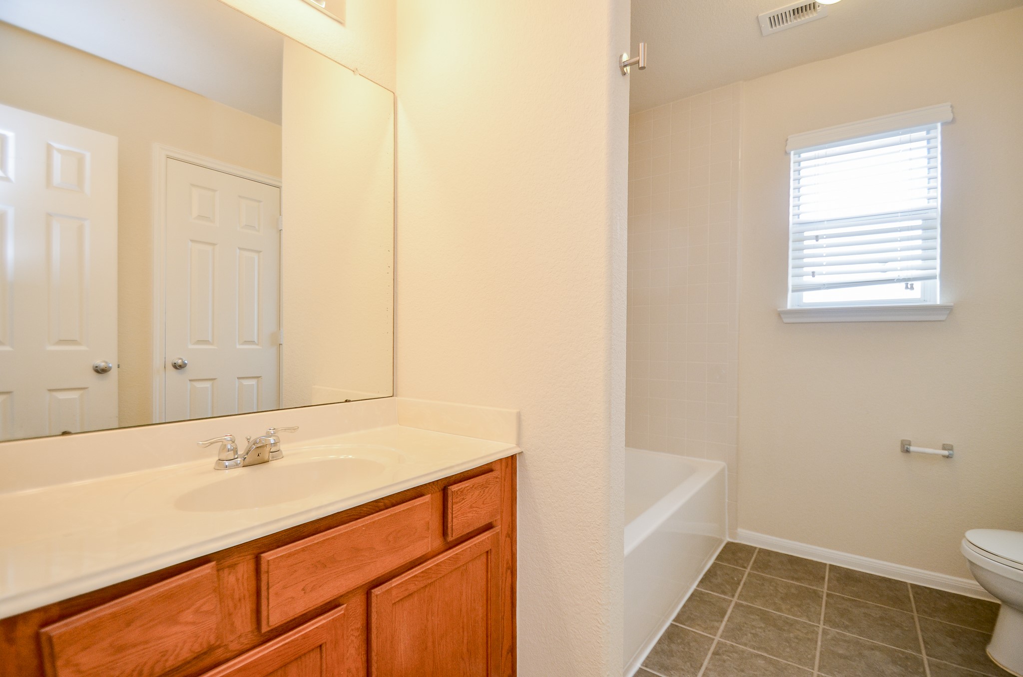 2903 Gaelic Green Street Houston, TX 77045 - Photo 23 of 32 a bathroom with a sink a toilet and shower