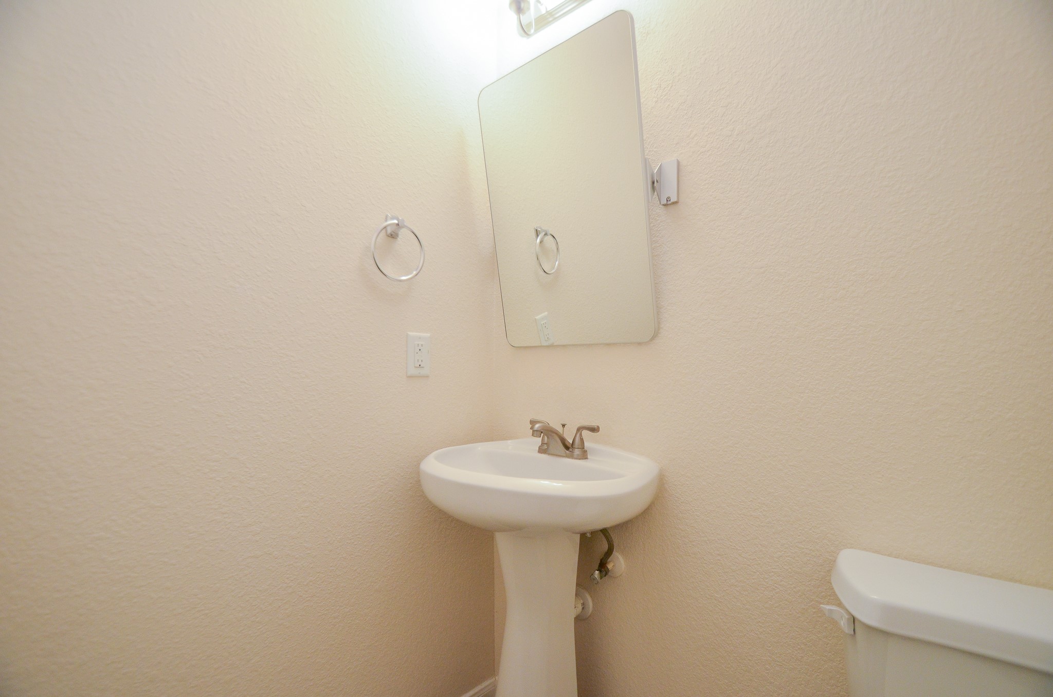 2903 Gaelic Green Street Houston, TX 77045 - Photo 28 of 32 a bathroom with a sink a toilet and mirror