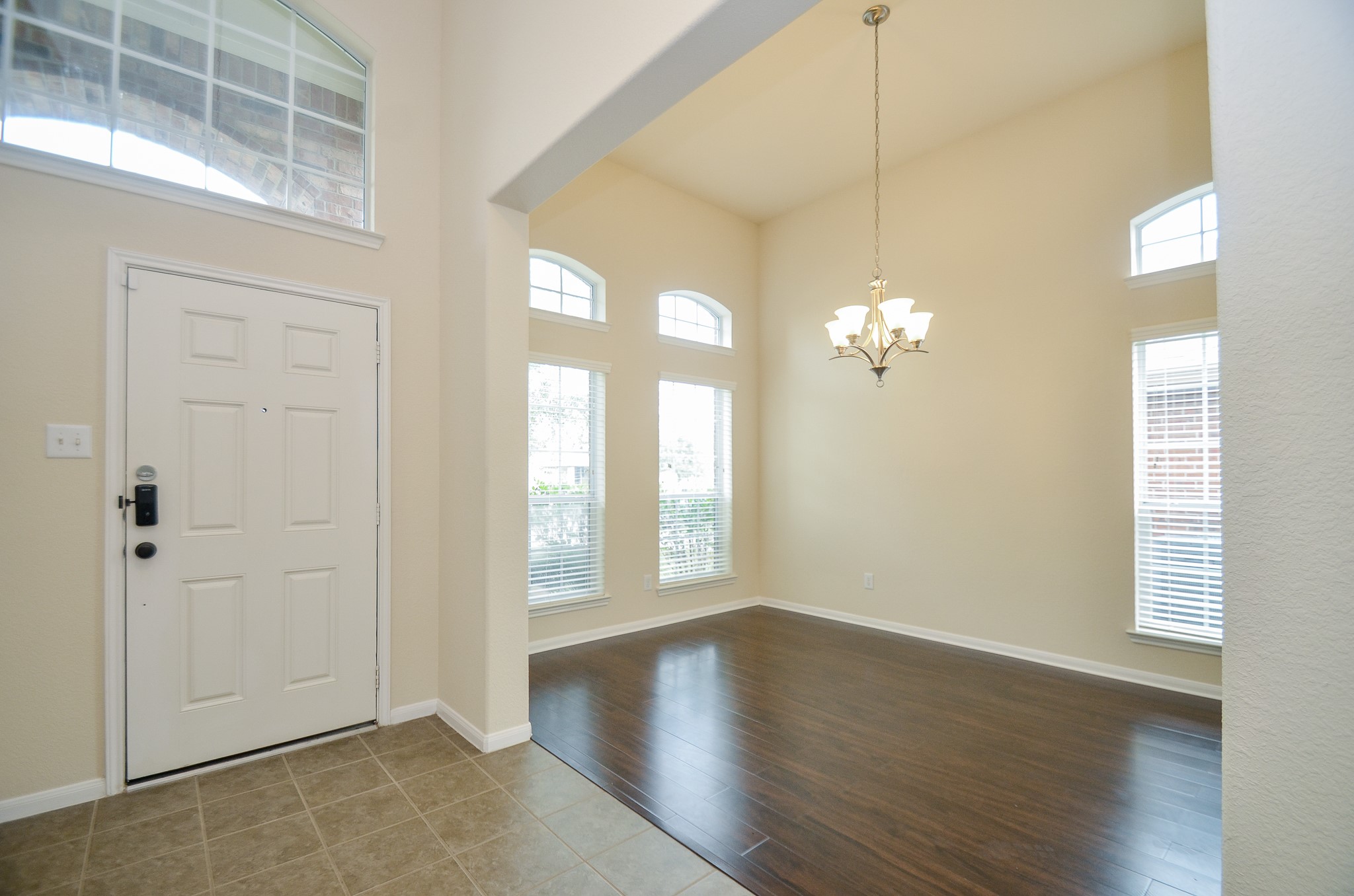 2903 Gaelic Green Street Houston, TX 77045 - Photo 4 of 32 wooden floor in an empty room with a window