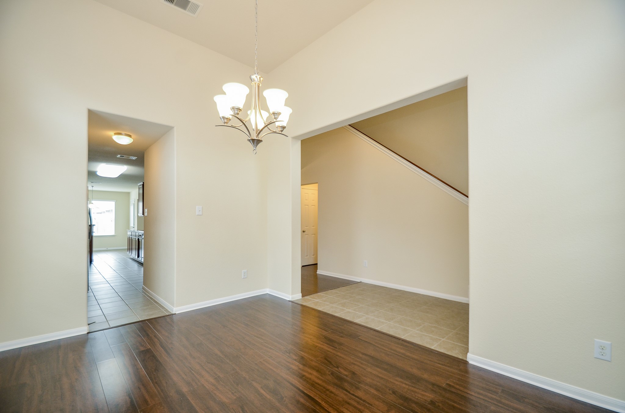 2903 Gaelic Green Street Houston, TX 77045 - Photo 5 of 32 an empty room with wooden floor and ceiling fan