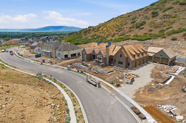 1817 North Dean Court, Unit 12 Alpine, UT 84004 - Photo 31 of 38 Hillside property with a brick exterior and a multi-gabled roofline