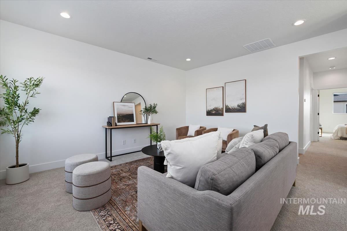 749 South Calhoun Lane Star, ID 83669 - Photo 9 of 34 Carpeted living room featuring recessed lighting