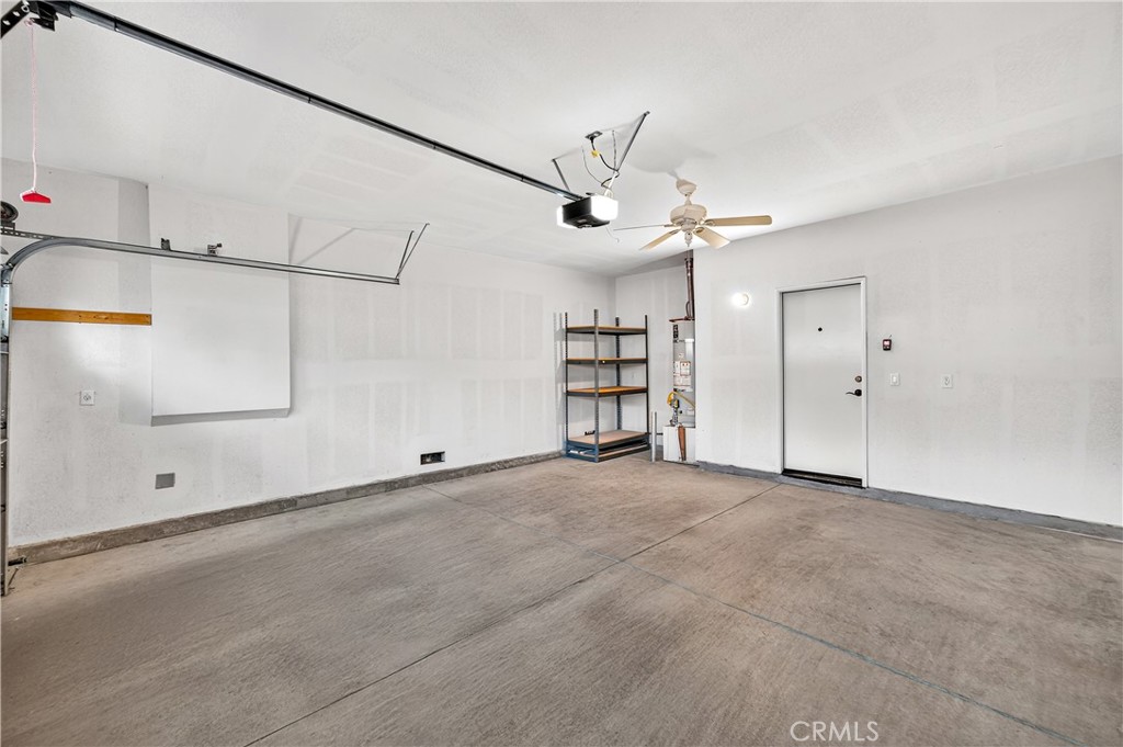 215 Firestone Lane Hemet, CA 92545 - Photo 38 of 61 an empty room with ceiling fan and windows