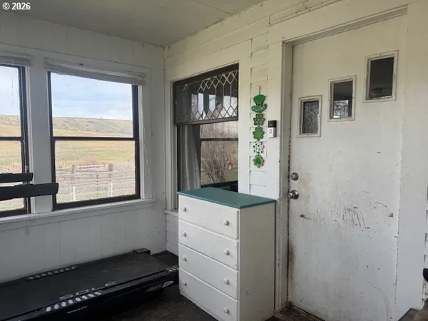 a room with window and cabinet