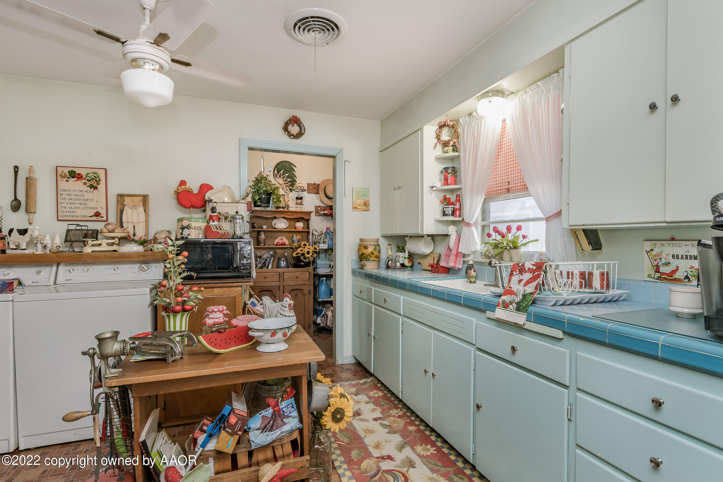 1538 Bell Street Amarillo, TX 79106 - Photo 11 of 26 a kitchen filled with a white stove top oven sink and a refrigerator