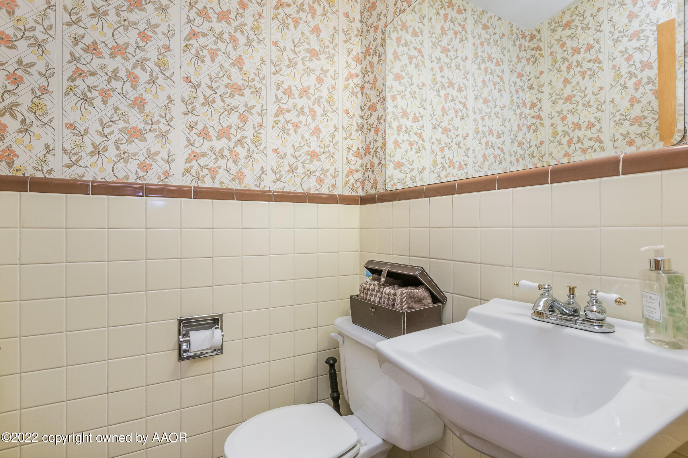 1538 Bell Street Amarillo, TX 79106 - Photo 17 of 26 a bathroom with a toilet sink and mirror