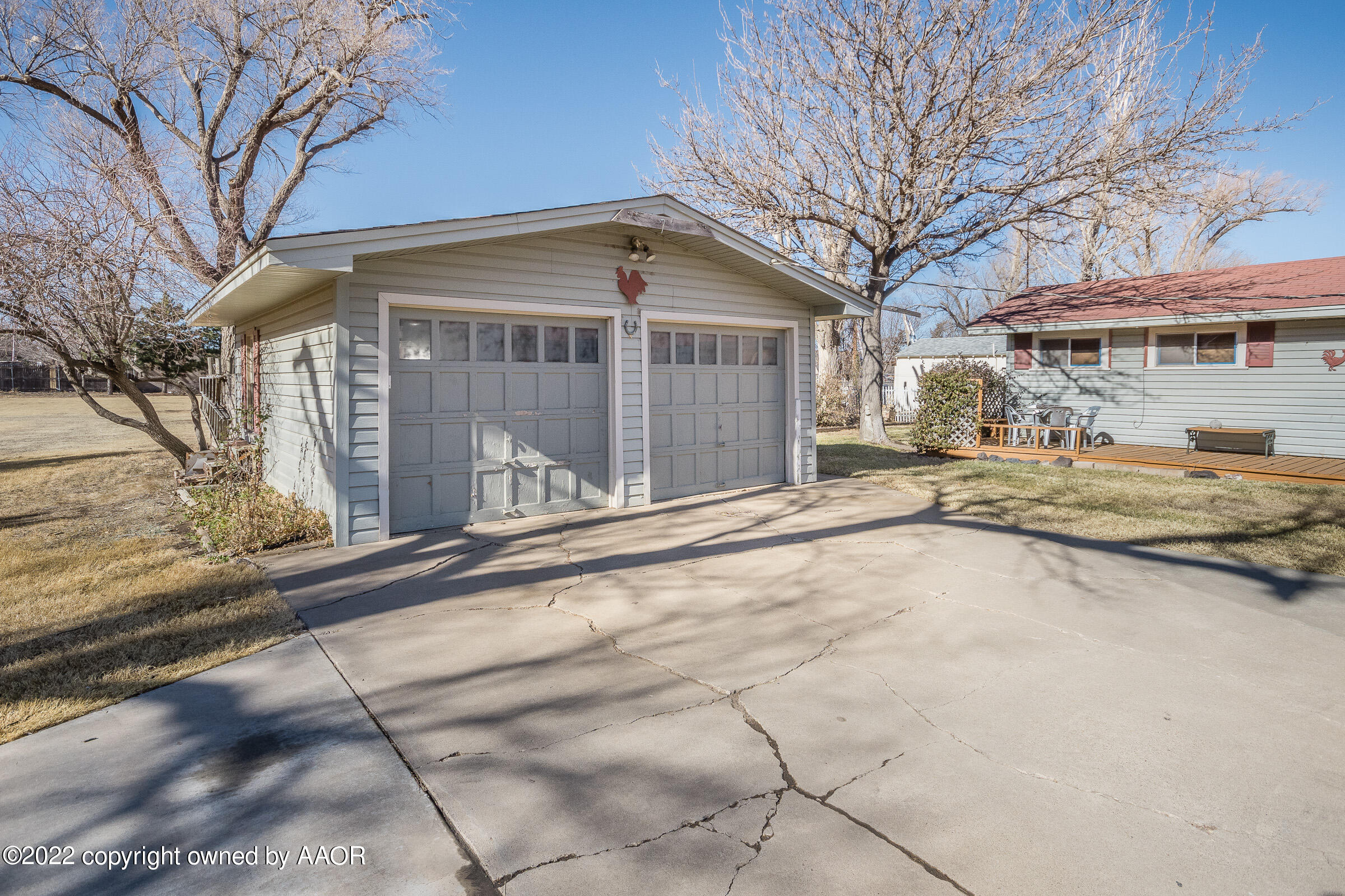 1538 Bell Street Amarillo, TX 79106 - Photo 23 of 26 a front view of a house with a yard and garage