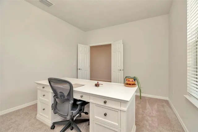 a large kitchen with cabinets stainless steel appliances a sink and a counter top space