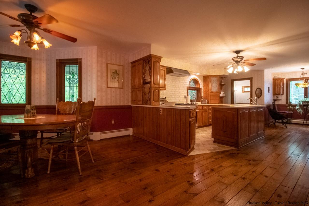30 Peak Farm Road Stone Ridge, NY 12484 - Photo 12 of 35 a view of a dining room with furniture and chandelier