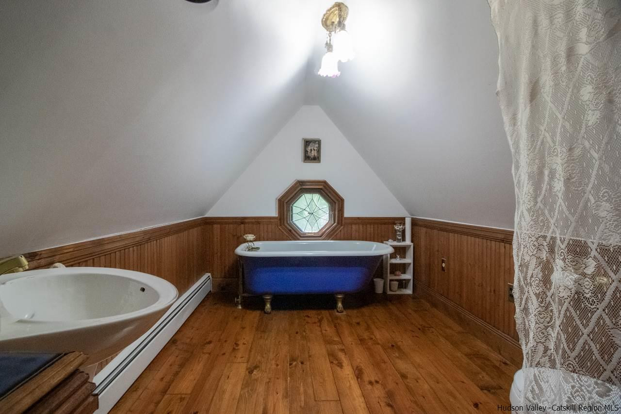 30 Peak Farm Road Stone Ridge, NY 12484 - Photo 33 of 35 a bathroom with a toilet a sink and mirror