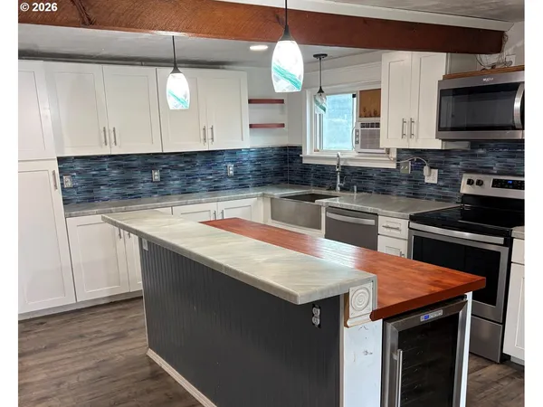 a kitchen with a sink and a microwave